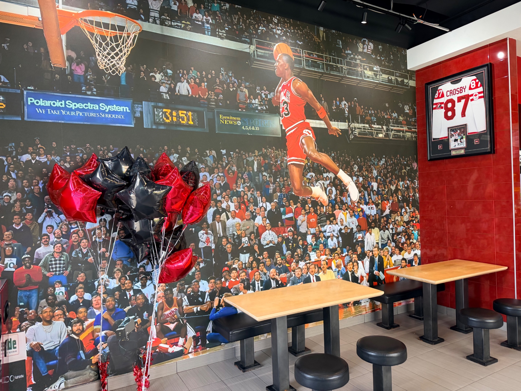 Hall of Flame dining area beneath the Michael Jordan slam dunk mural